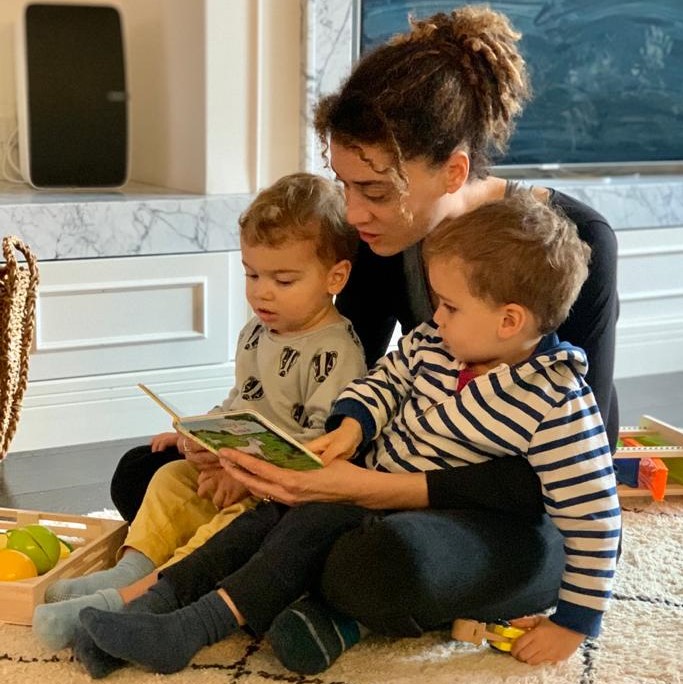 Natalie read a story to her two young boys