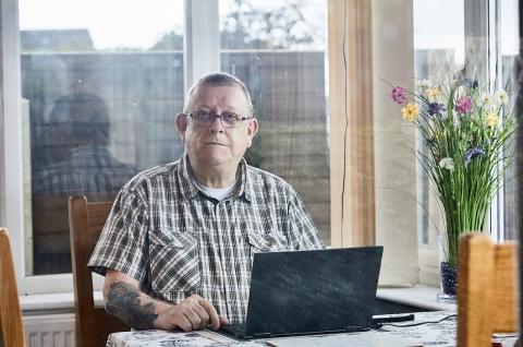 A man using his laptop at home
