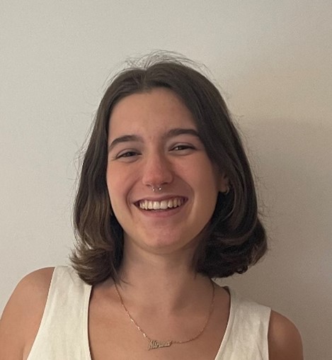 A portrait photograph of a young woman smiling.