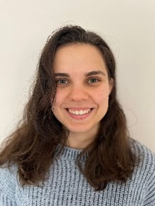 A portrait shot of a smiling young woman.