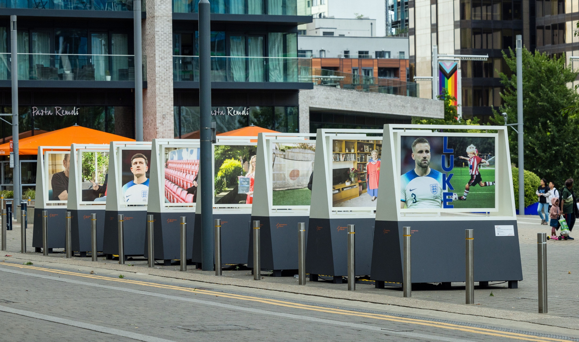 A selection of boards with large photographs on as part of Alzheimer's Society's 'Football should be unforgettable' exhibition at Wembley Park