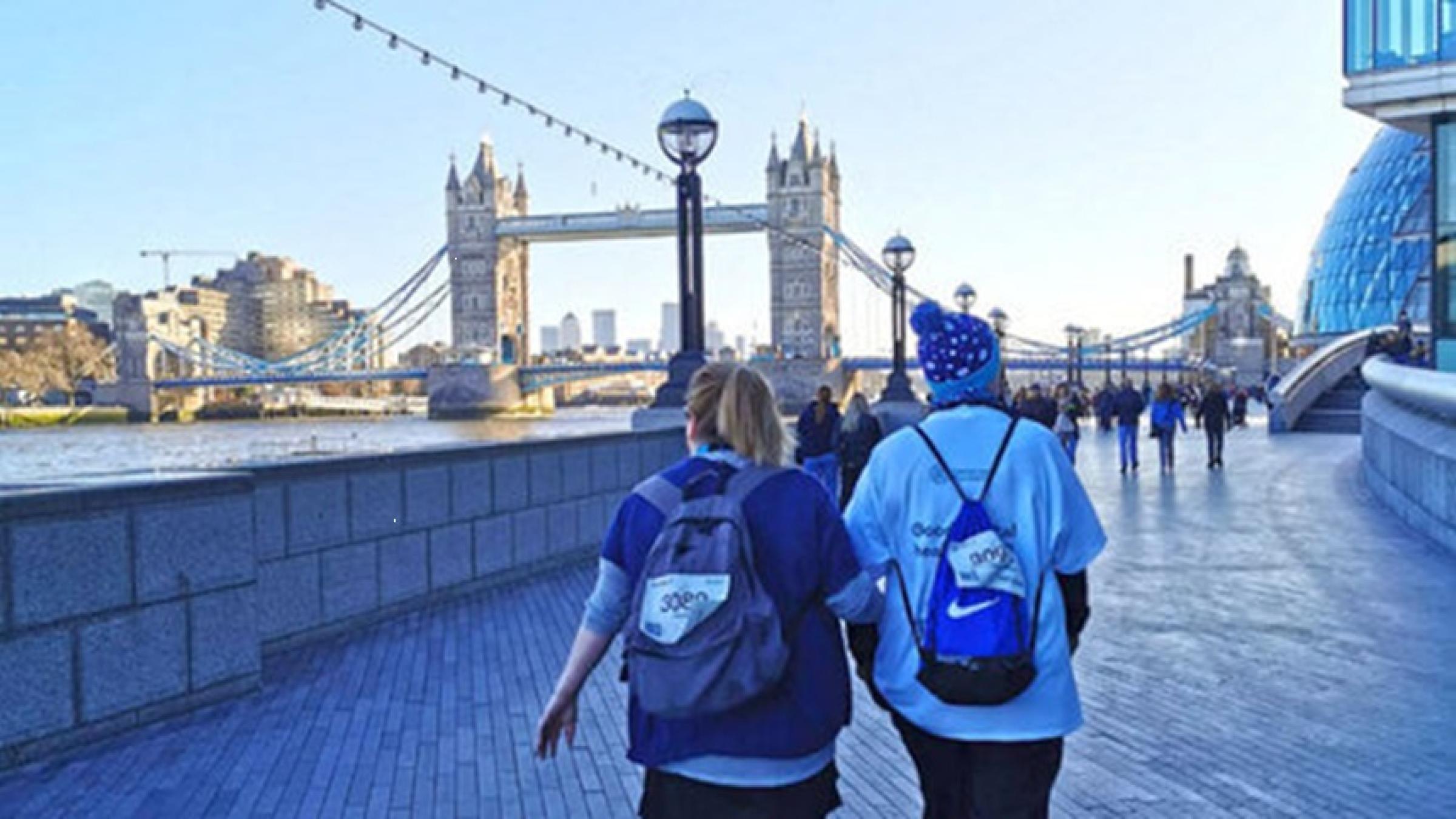 Walkers in front of Tower Bridge