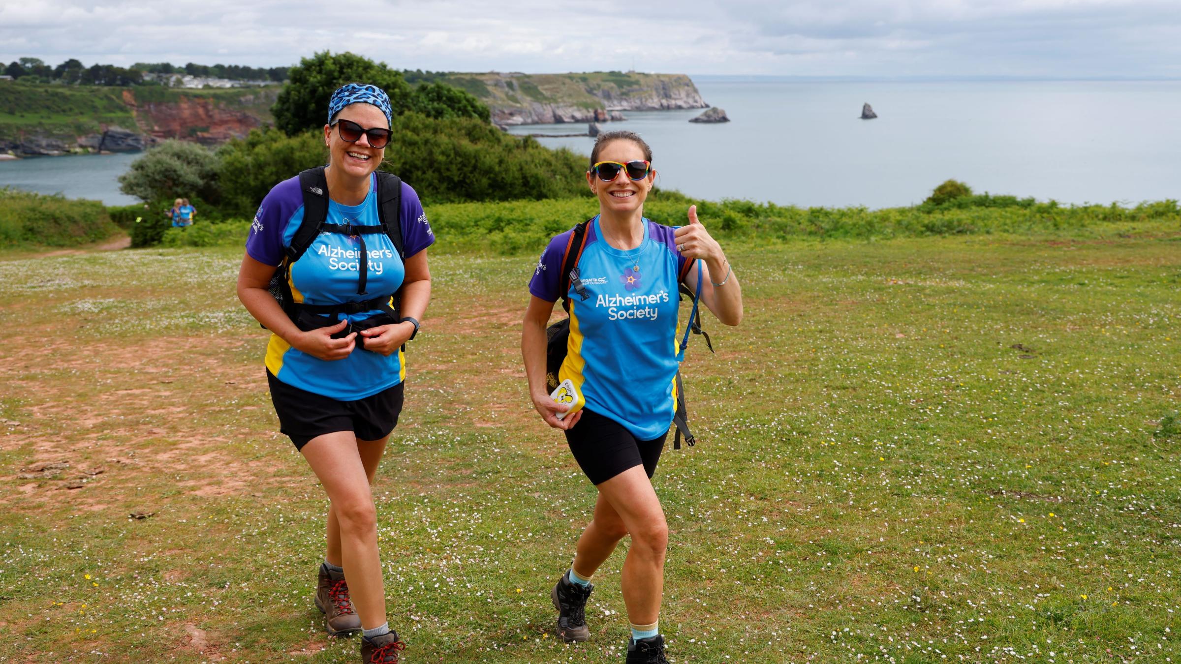 Two trekkers walking Trek26 South Devon Coast