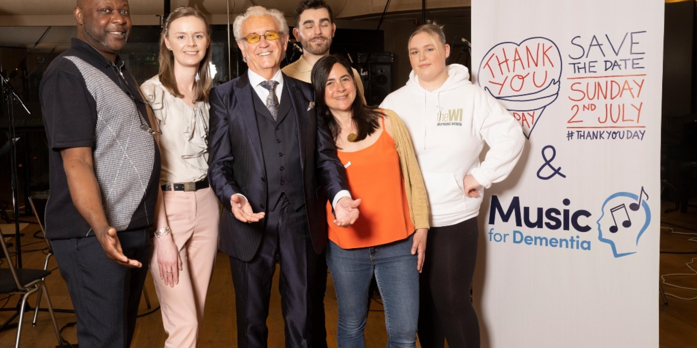 Tony Christie with a group of carers of people with dementia during a music recording