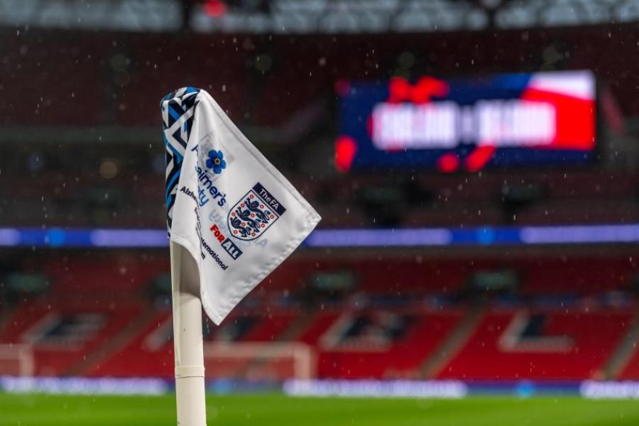 A flag with FA and Alzheimer's Society logos on