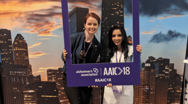 Aoife Kiely with Sahdia Parveen, holding up an AAIC sign