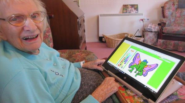 Heather's mum colouring using a tablet