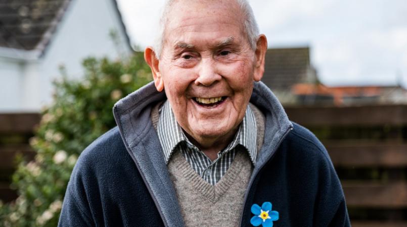 Geoff wearing a Forget Me Not Appeal pin badge
