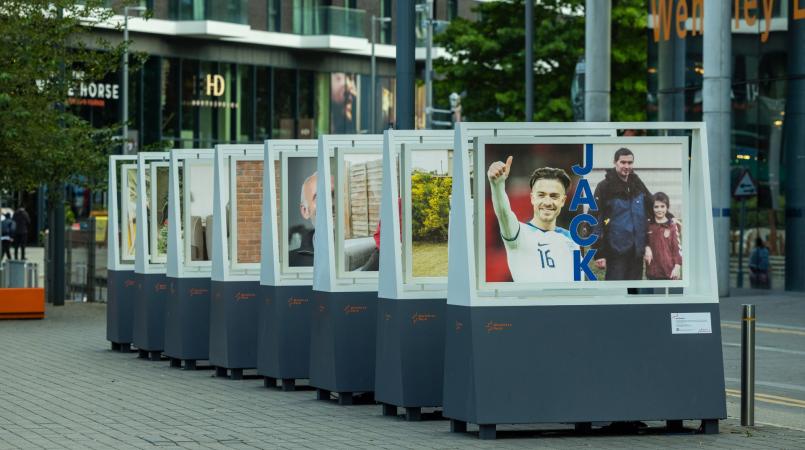 A selection of boards with large photographs on as part of Alzheimer's Society's 'Football should be unforgettable' exhibition at Wembley Park