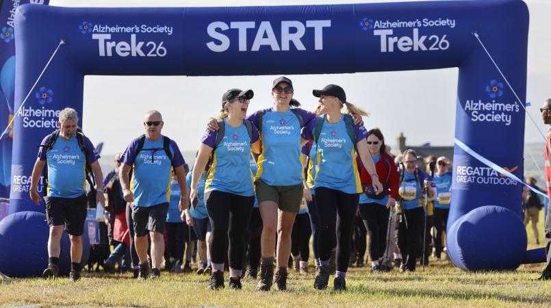 Group of three women celebrating crossing the finish line