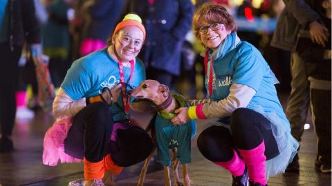 GLOW walkers in fancy dress with dog