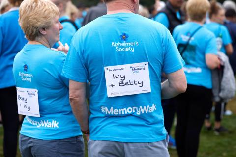 Two walkers with their 'walking for' labels 