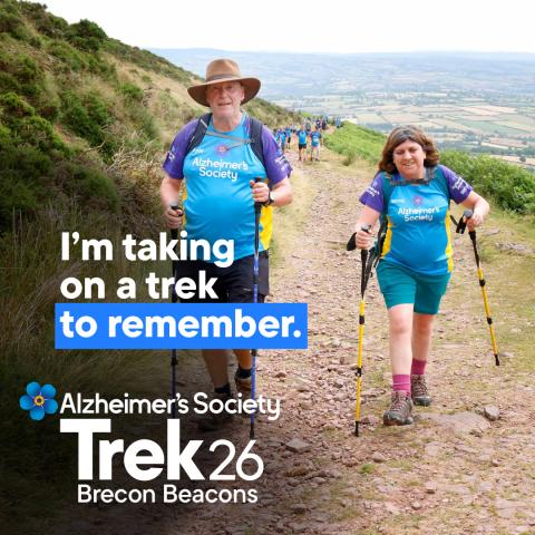 Two trekkers trekking through the Brecon Beacons with the text 'I'm taking on a trek to remember'