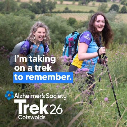 Two females trekking through a field with the text 'I'm taking on a trek to remember'