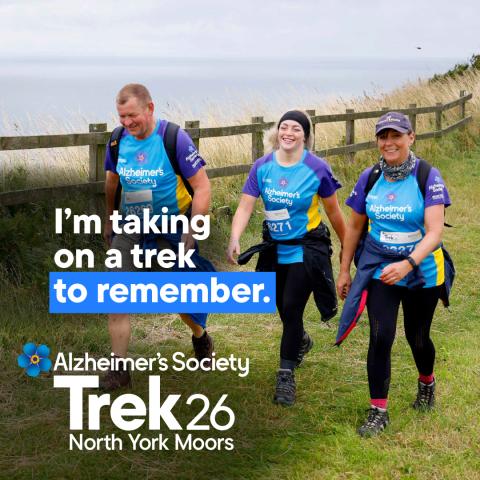 A group of trekkers trekking near the sea with the text 'I'm taking on a trek to remember'