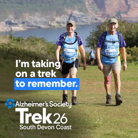 Two trekkers trekking through a field with the text 'I'm taking on a trek to remember'