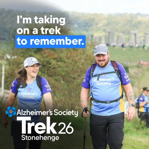 Two trekkers trekking through a field with the text 'I'm taking on a trek to remember'