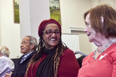 Two women smiling at each other