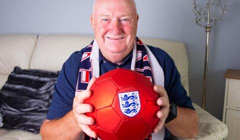 A man holding an England football