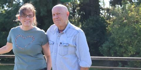 Kirsty and Roy stand outside together