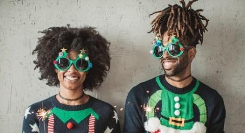 Two people dressed in elf costumes